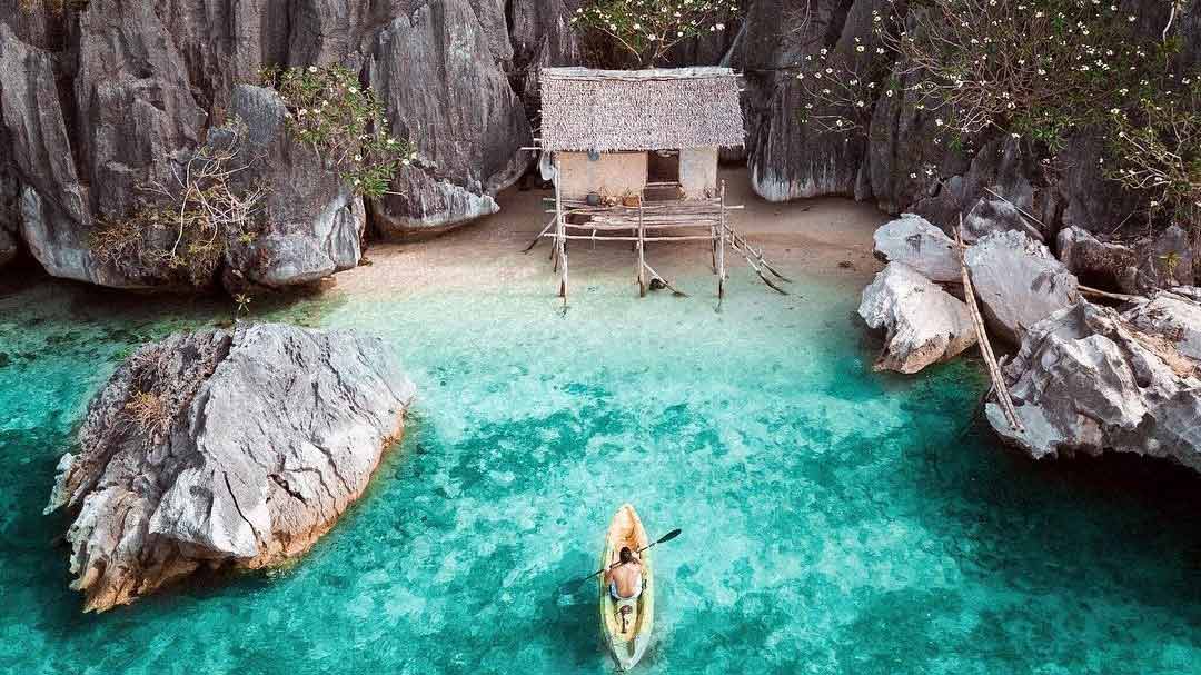 Little ut and a kayak on a secluded beach